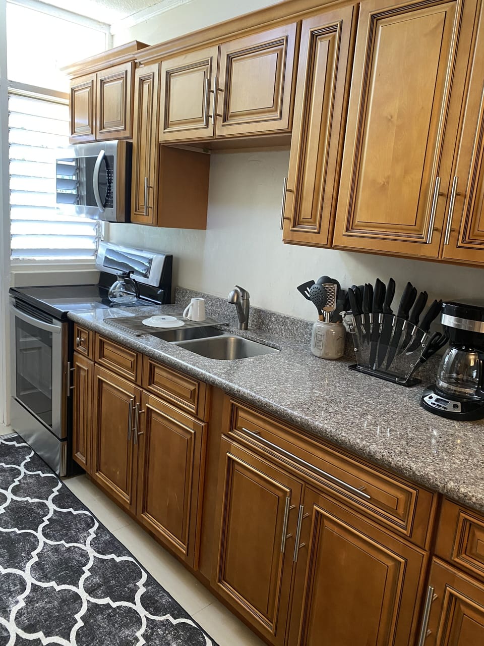 Stocked Kitchen with Utensils and Coffee Maker.  Spacious Refrigerator  