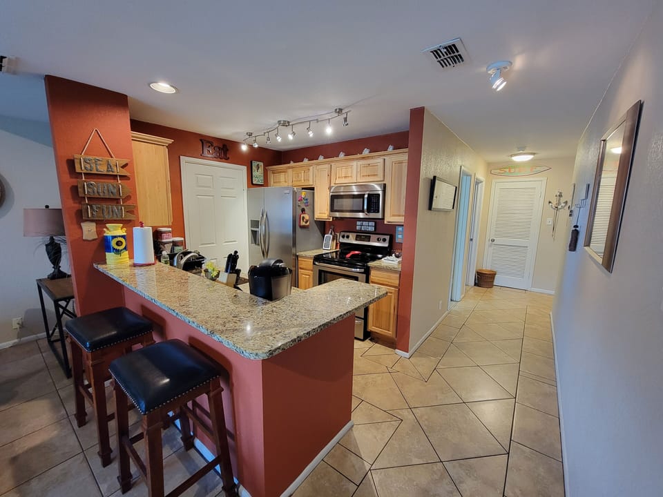 Kitchen has everything needed for cooking and dining.