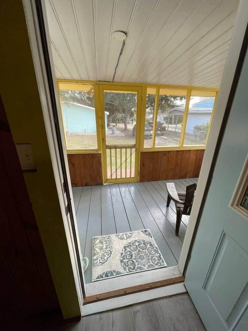 view from living room to front screened porch