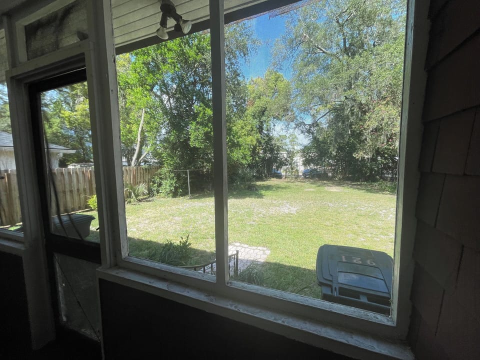 view out the back porch to the parking area (backyard)
