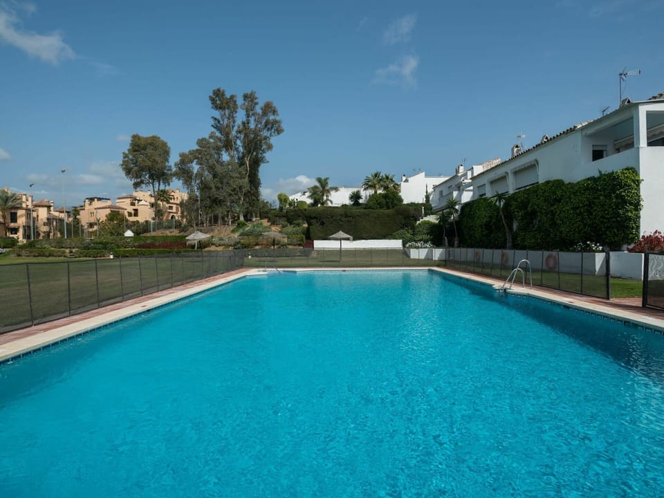 Water, Sky, Plant, Cloud, Swimming Pool, Azure, Body Of Water, Building, Grass, Tree