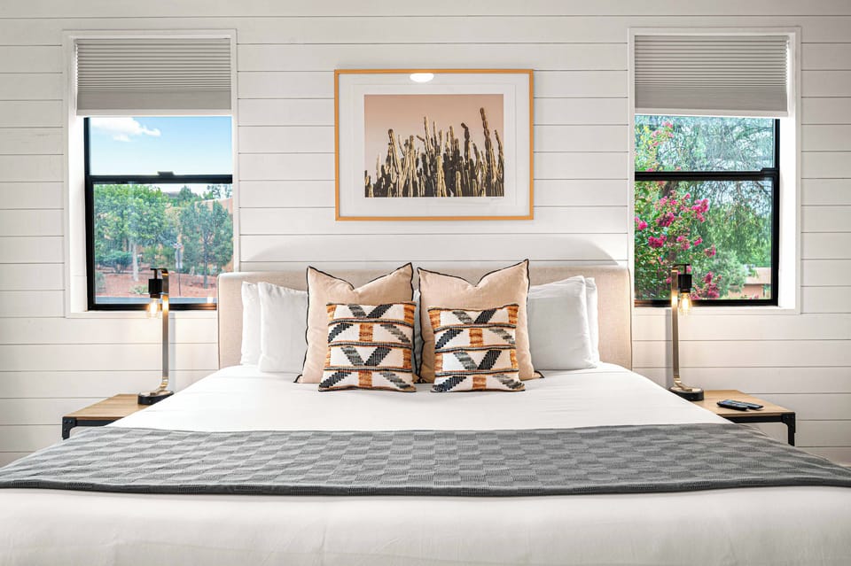 {Bedroom 1} Retreat to a luxurious king bed in this bright, serene suite with its own private spa-inspired ensuite bath.