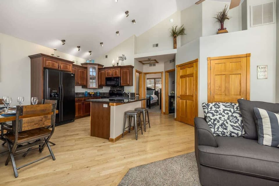 full view from living room of kitchen and dining area