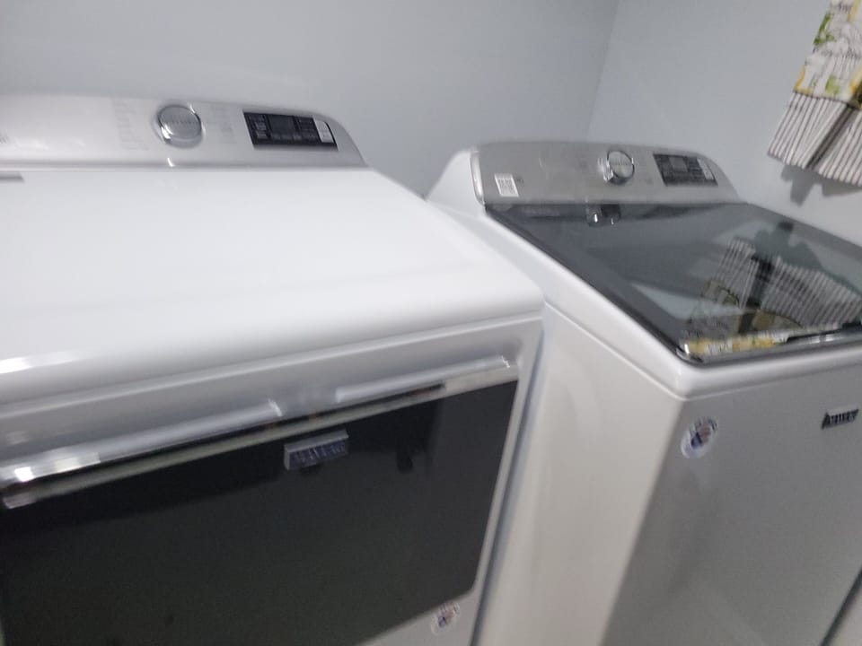 commercial maytag washer and dryer off master hallway