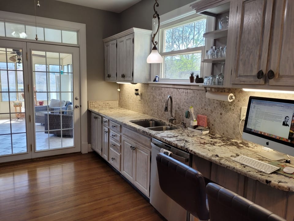 French doors that lead to the enclosed sun porch