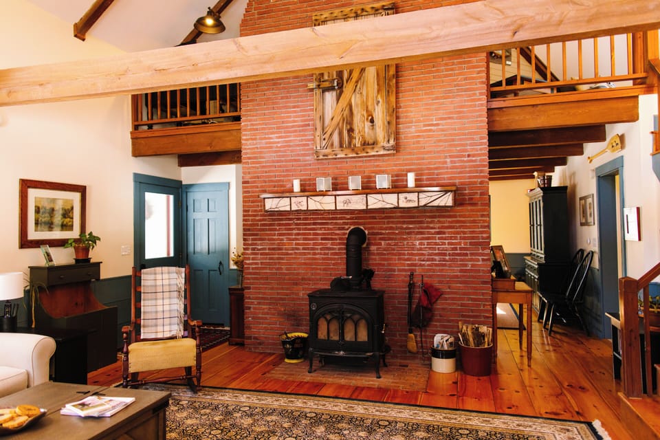 View from couch Chaise; dining room/kitchen on other side of the fireplace