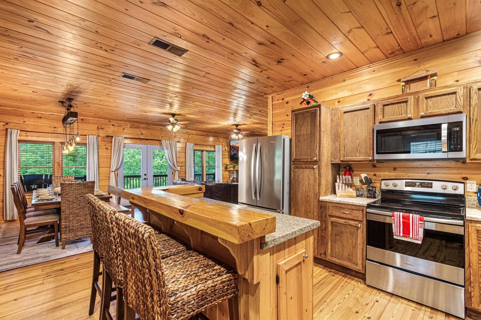 Kitchen & Dining Oasis: Modern appliances meet rustic charm for unforgettable meals and memories!