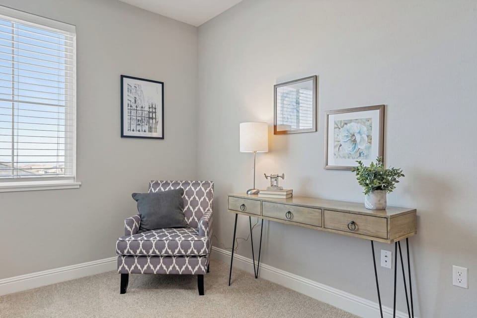 An accent chair and console table.