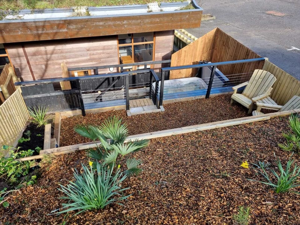 The terraced garden area to the rear  is accessed via steps from the back door