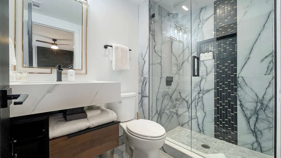 The first king suite features a beautifully elegant en-suite, designed for a true spa-like feel.