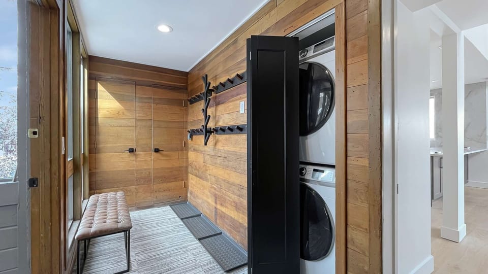 The ultimate drop zone! Custom storage handles your gear, plus a handy setup for vacation laundry.