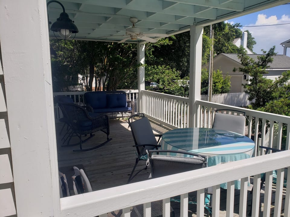 Spacious covered porch with comfy porch furniture 