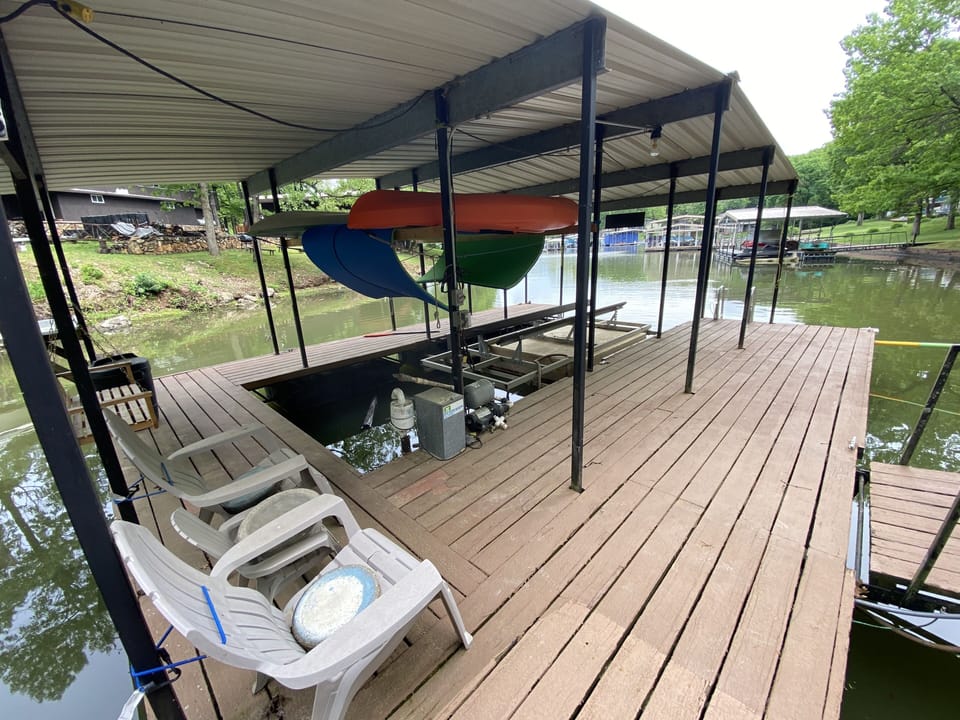 Boat Slip with Lift. Lily pad and kayaks.