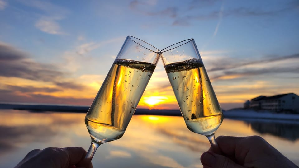 Toast to the Sunset, its just steps to the beach from Juan Love.