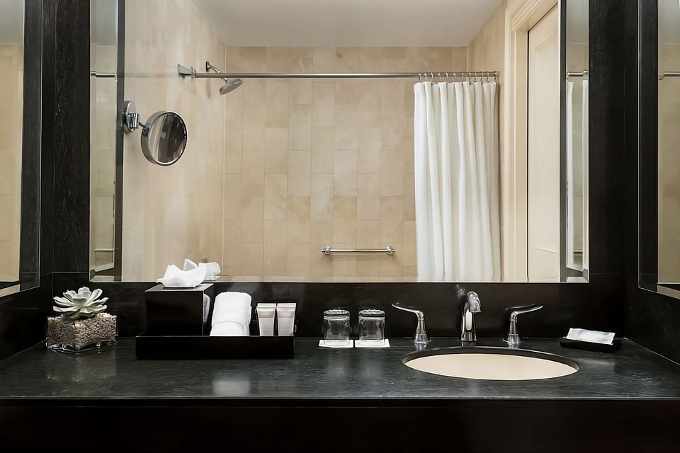 Refresh at the sleek vanity with spa-style amenities.