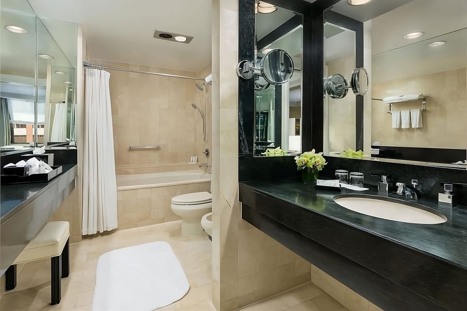Refresh in a spa-like bath with bright vanity lighting.