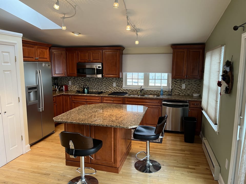 Granite counter top, stainless appliances.