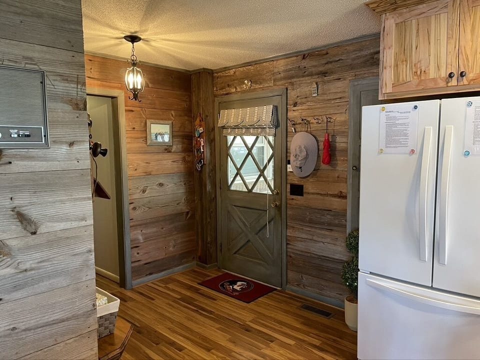 Carport door, walking into house.