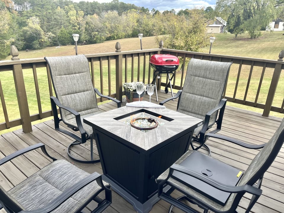 Outdoor firepit to enjoy on chilly nights, charcoal grill for delicious meals.