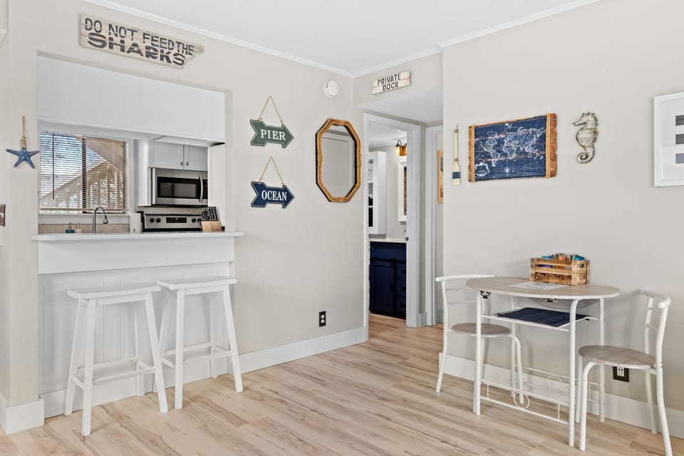 Table with 2 Chairs and Barstool seating