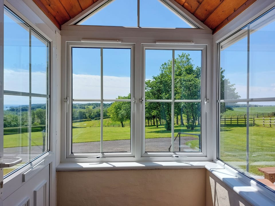 View over garden | Bay View - Coastal Cottages, Saundersfoot