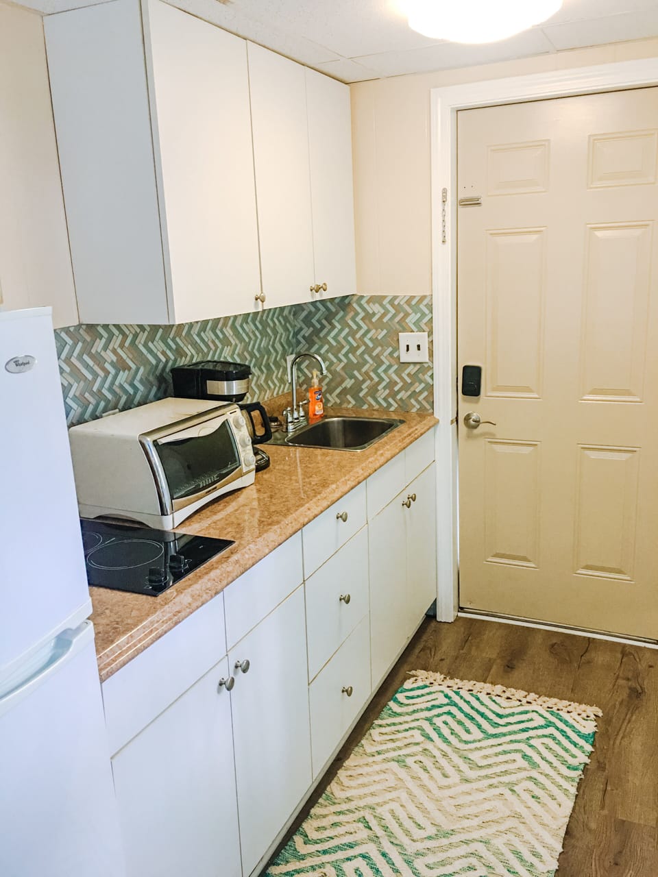 Kitchenette with Toaster Oven, Full Refrigerator, Cooktop, and Coffee Maker