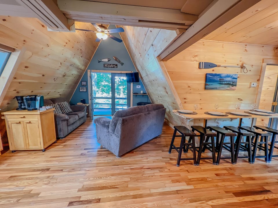 Living room area with smart tv, Blu-ray player, and an amazing view of the pond!
