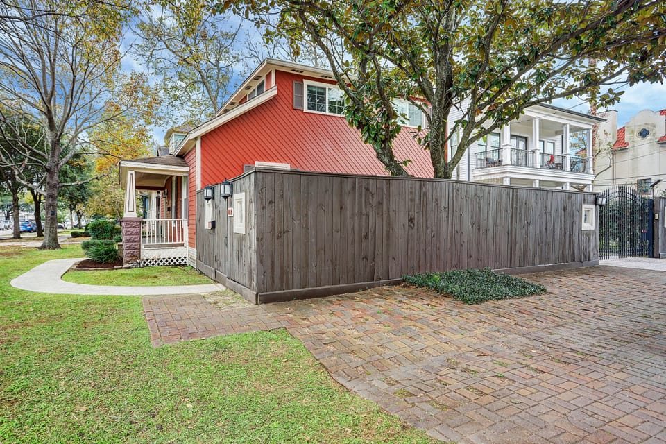 Paved off street parking at side fence.  Driveway is for upstairs tenant only.