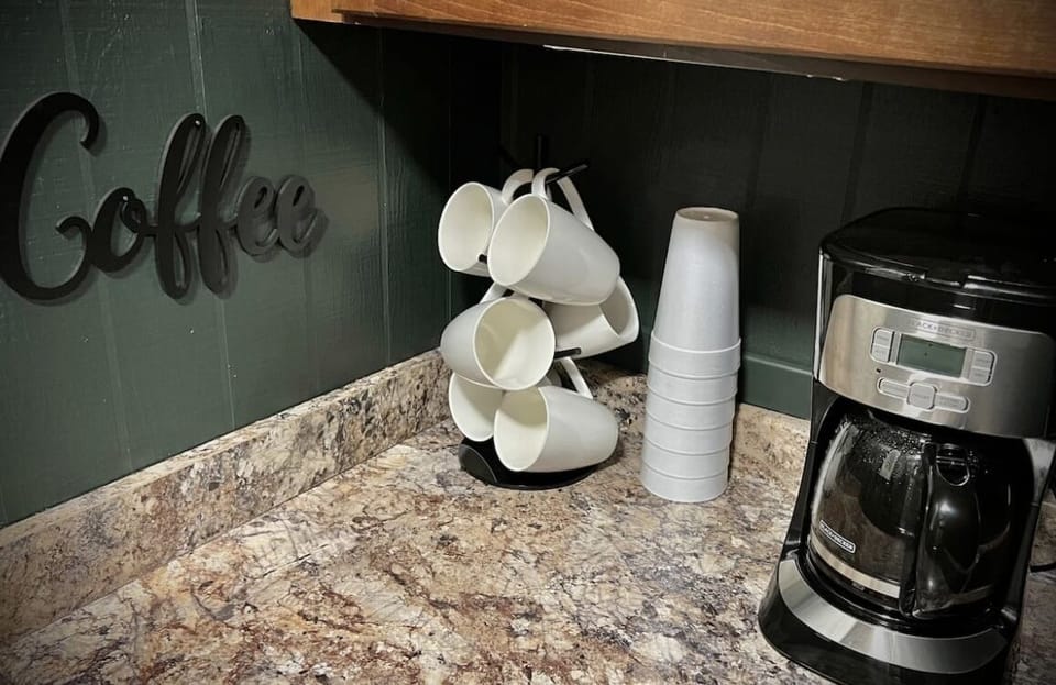 Coffee bar in kitchen. We provide coffee and to go cups - essentials!