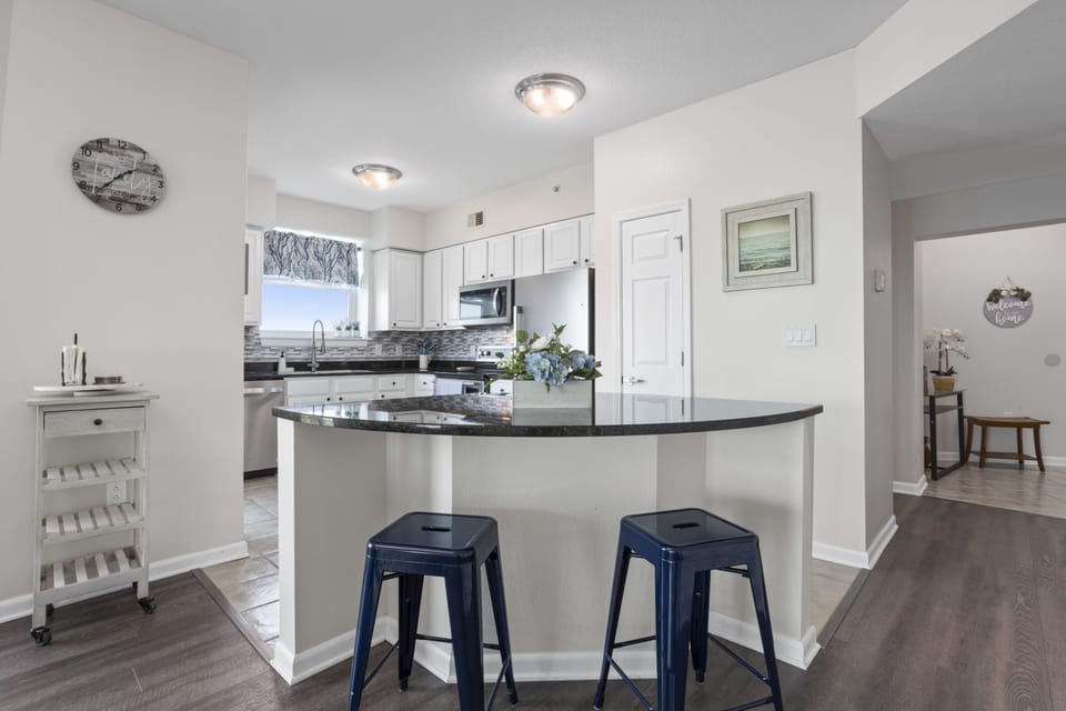 Kitchen island has bar stools for counter seating