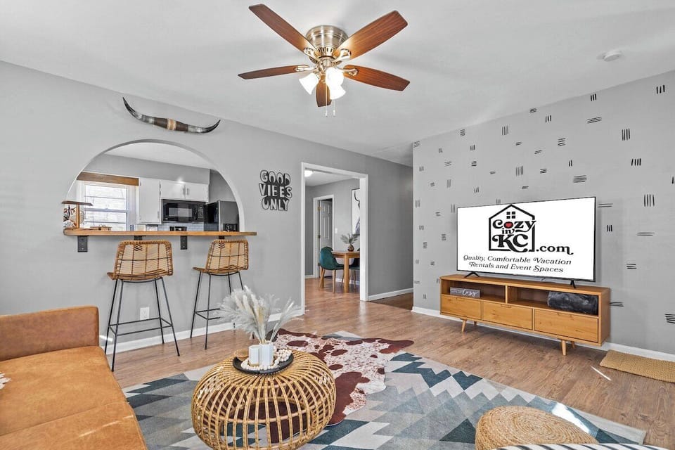 Boho-Chic Lounge Space Featuring Stylish Rattan Furniture, a Large Smart TV and Thoughtful Design Details.