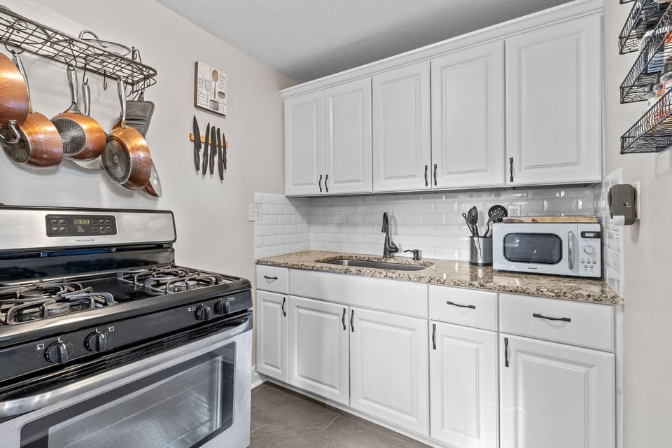 Fully equipped kitchen with gas stove, cookware, and all essentials for longer stays