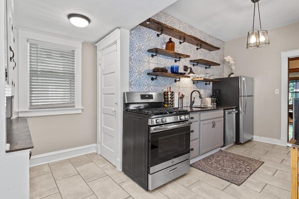 Beautifully updated cooking area blending modern upgrades with vintage details for a warm, inviting feel.