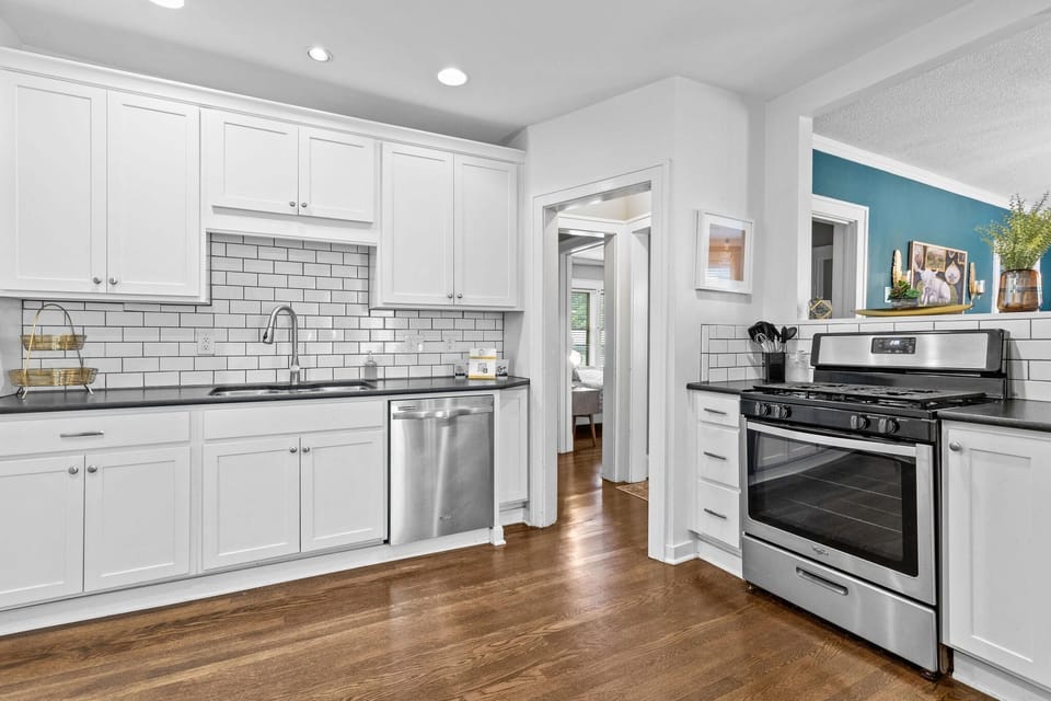 Kitchen: Modern design with stainless steel appliances and sleek countertops for culinary adventures!