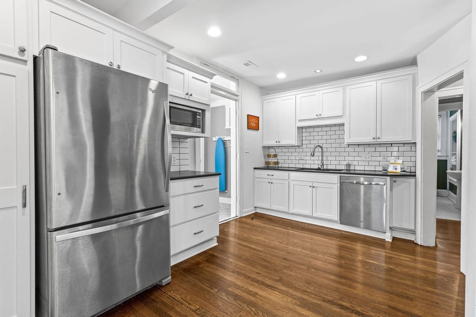 Kitchen: Modern design with stainless steel appliances and sleek countertops for culinary adventures!