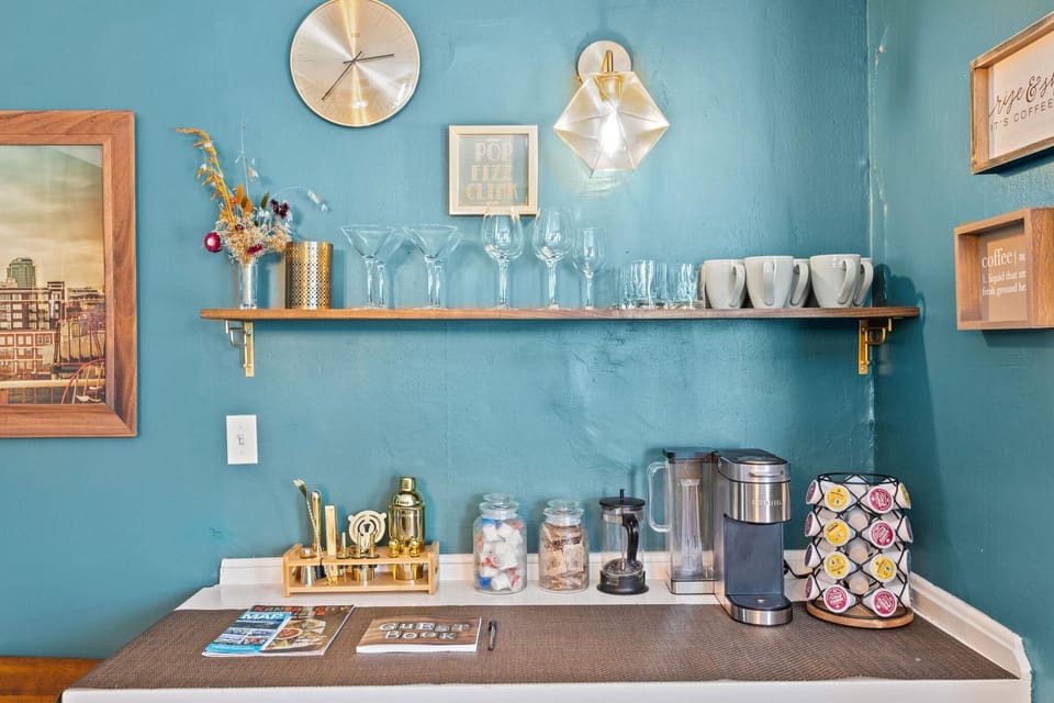 Stylish coffee and beverage station with mugs, glassware, and everything you need to start your day.