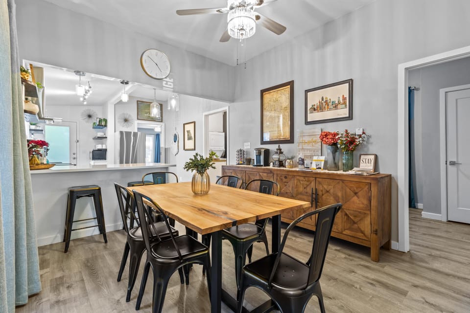This charming dining nook flows seamlessly from the kitchen, offering the ideal place for meals, board games, or morning coffee.
