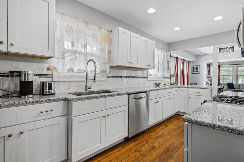 Kitchen: Bright & inviting space with modern appliances and granite countertops for culinary adventures!