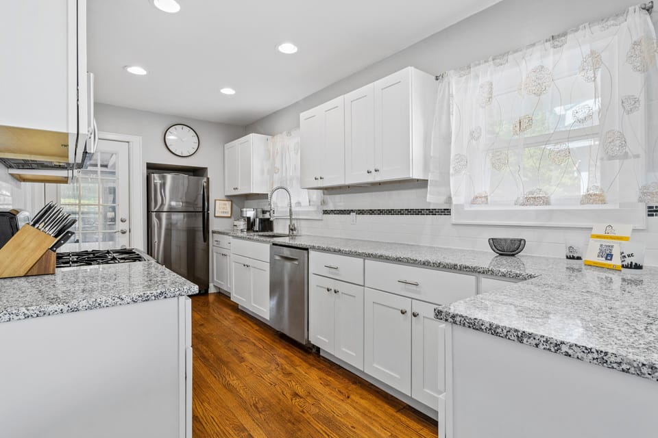 Kitchen: Bright & inviting space with modern appliances and granite countertops for culinary adventures!