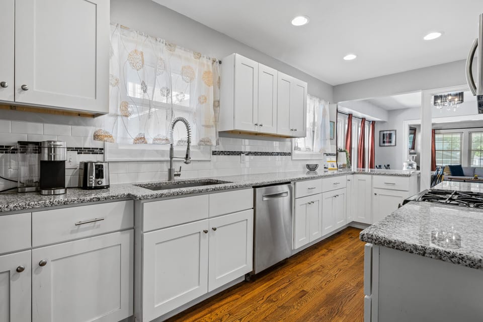 Kitchen: Bright & inviting space with modern appliances and granite countertops for culinary adventures!