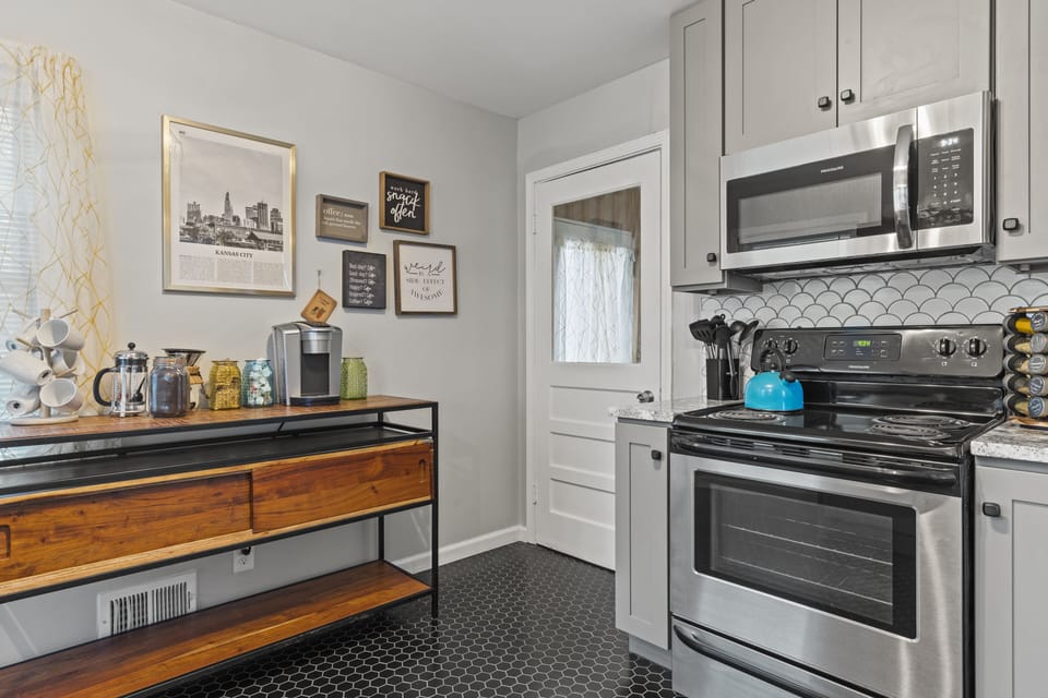 Updated stainless appliances and fully stocked cookware make this kitchen move-in ready for extended stays of 30 days or more.