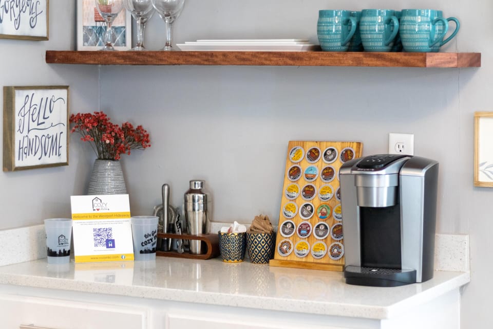 Coffee bar stocked with coffee grounds, mugs, and essentials—your cozy Westport home base starts every morning with convenience and comfort.