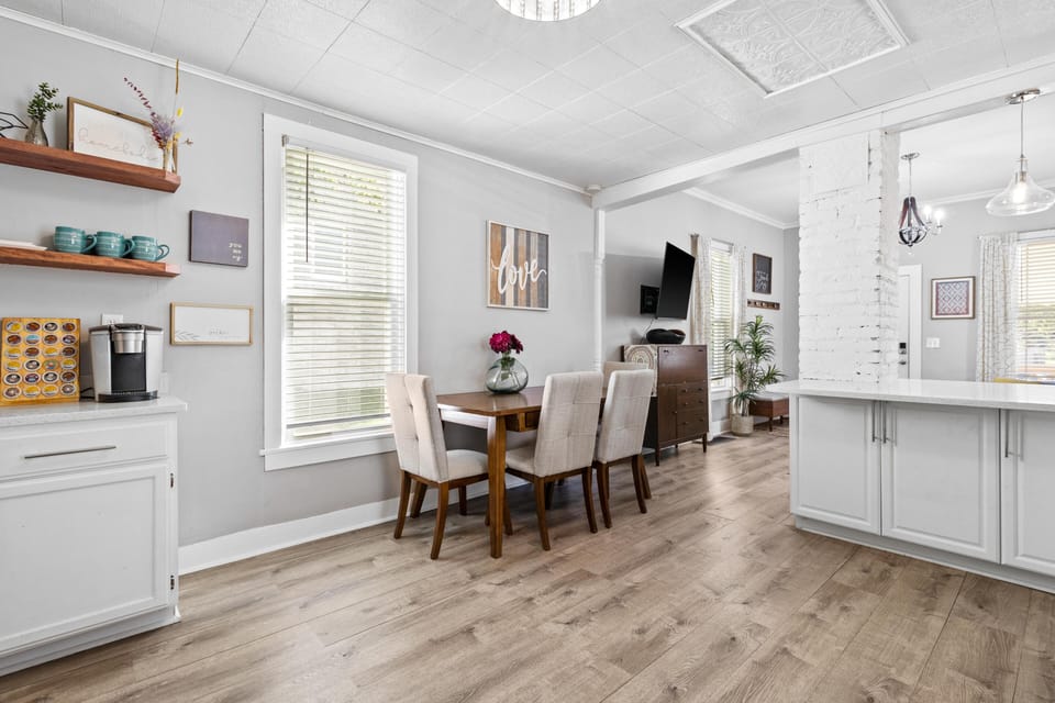 Cozy dining space just off the kitchen, perfect for meals, remote work, or gathering before a night out in Westport. Bright, open layout offers easy flow to the living room—ideal for groups exploring KC and the nearby streetcar.