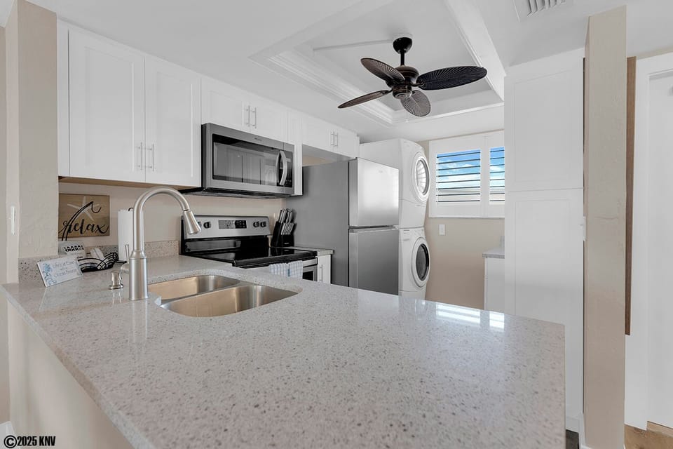 New Kitchen Appliances in a fully equipped kitchen with cookware, and tableware