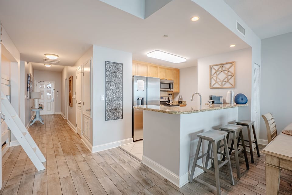 Bright kitchen with stainless appliances and plenty of counter space for cooking.