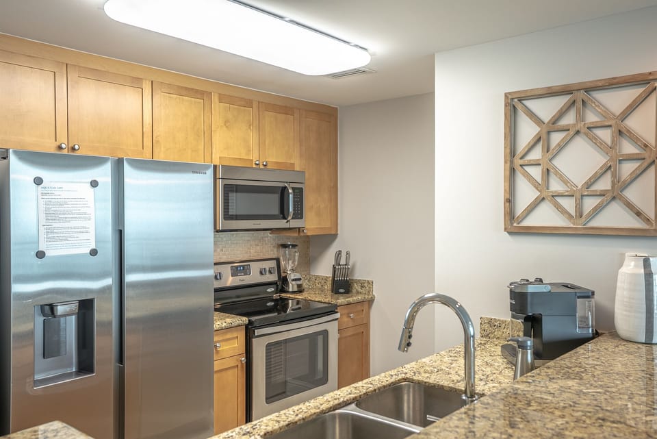 Kitchen with stainless appliances, granite counters, and plenty of prep space.