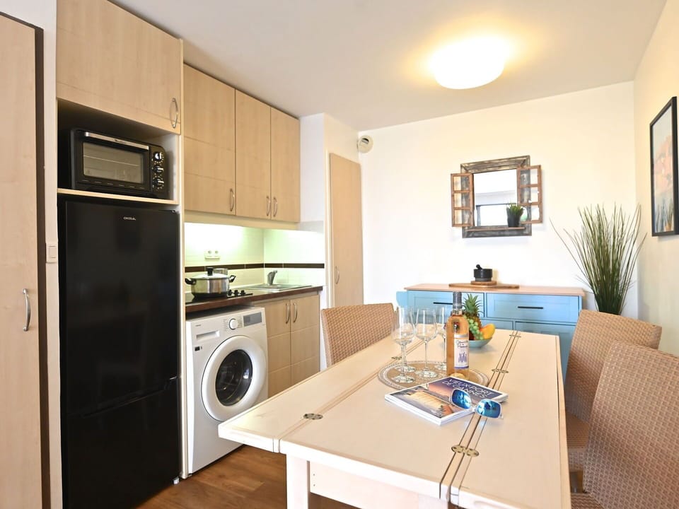 Furniture, Interior Design, Flooring, Kitchen, Floor, Countertop, Wood, Major Appliance, Room, Ceiling