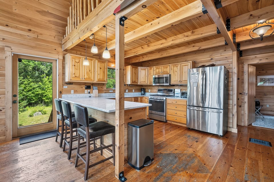 Kitchen Bar seating for 3 - door to deck with stairs to parking area