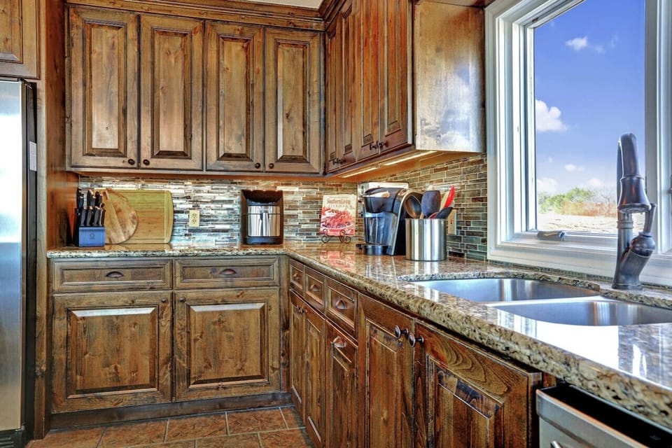 Cook with ease in the fully stocked kitchen at Lakeshore Haven on Lake Travis—everything you want and more for a great experience in Spicewood, TX.