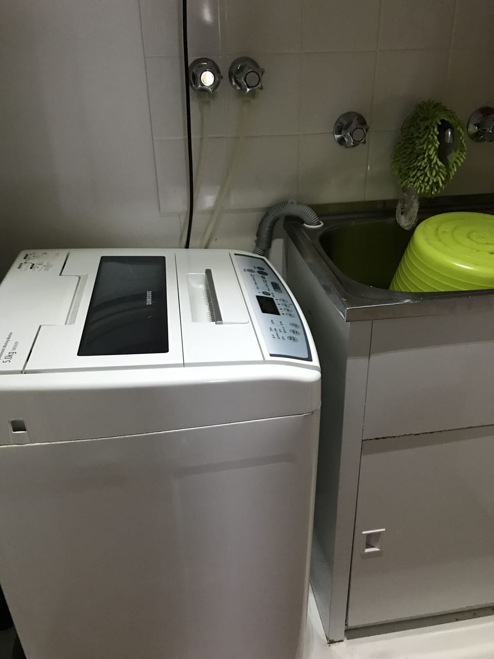 Laundry cabinet. There is also a communal laundry in the building with dryers.